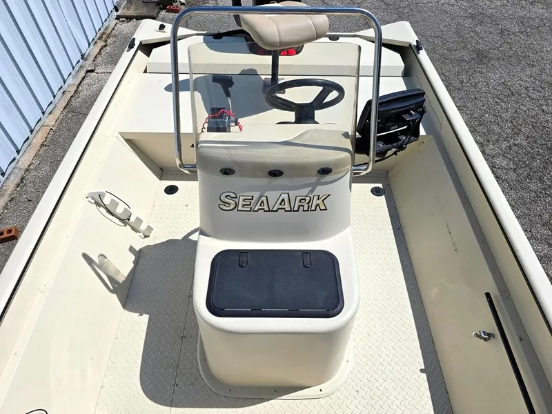 Slide: The Image of 2015 SeaArk RX18 Center Console boat interior with steering wheel and seating. - 11