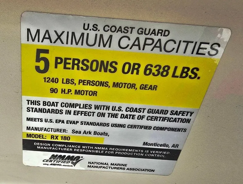 Slide: The Image of 2015 SeaArk RX18 Center Console capacity label, 5 persons or 638 lbs, 90 HP motor. - 13