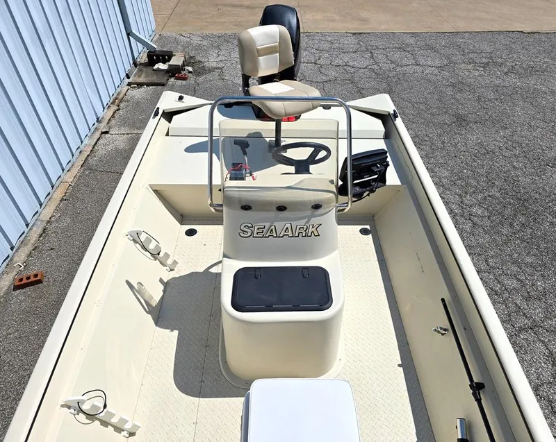 Slide: The Image of 2015 SeaArk RX18 Center Console boat with steering wheel and seating. - 3