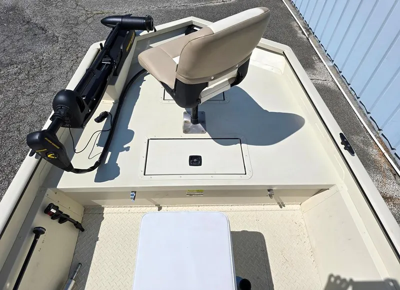 Slide: The Image of 2015 SeaArk RX18 Center Console boat interior with seat and trolling motor. - 6
