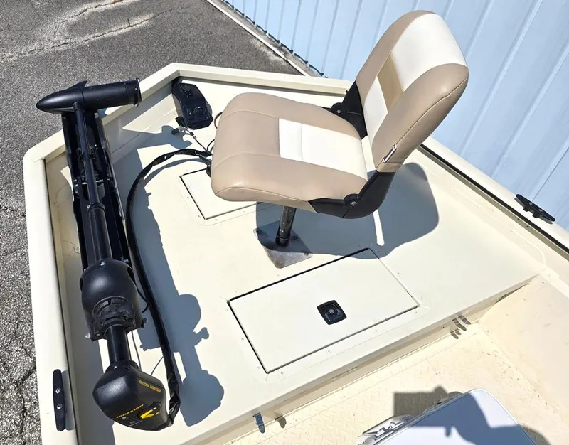 Slide: The Image of 2015 SeaArk RX18 Center Console boat with beige seat and trolling motor. - 7