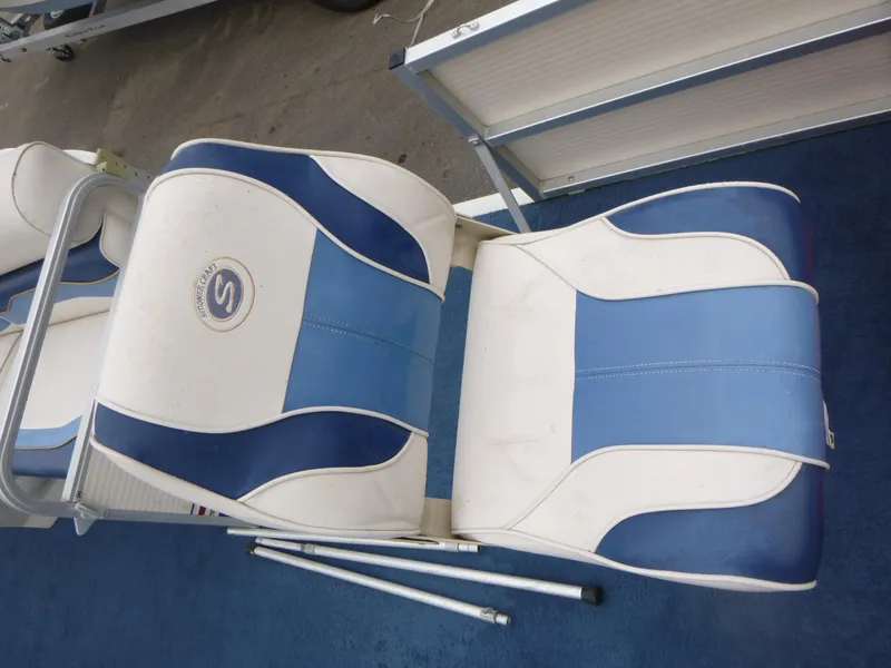 Slide: The Image of Blue and white boat seats on a 2000 Smoker Craft 818 4-Point. - 11