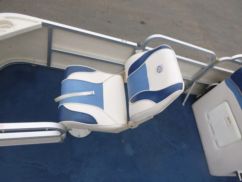 Slide: The Image of 2000 Smoker Craft 818 4-Point boat seat with blue and white upholstery. - 12