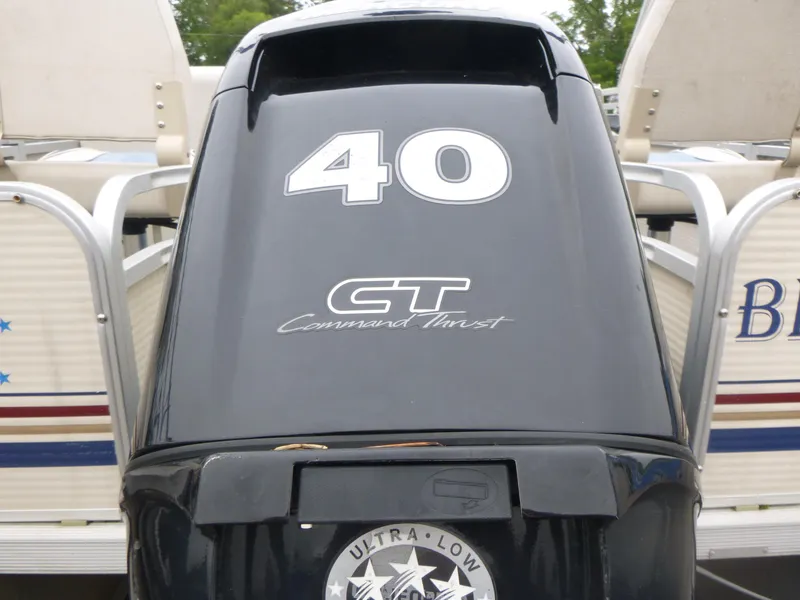 Slide: The Image of Outboard motor on a 2000 Smoker Craft 818 4-Point boat, featuring "40 CT Command Thrust." - 14