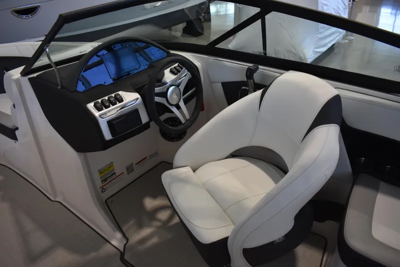 Slide: The Image of 2026 Regal 2000 ES boat interior with modern dashboard and comfortable seating. - 14
