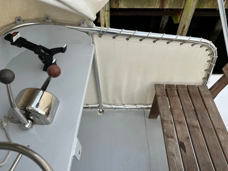 Slide: The Image of Boat cockpit with controls and wooden bench, BHM Sport Fish 2003 model. - 11