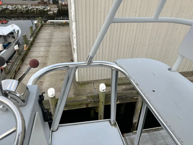 Slide: The Image of View from BHM Sport Fish 2003 boat's deck overlooking dock and water. - 17