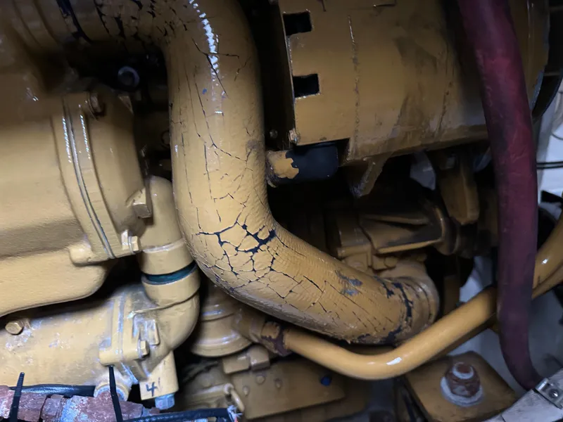 Slide: The Image of Cracked engine component of 2003 BHM Sport Fish boat, showing wear and tear. - 31