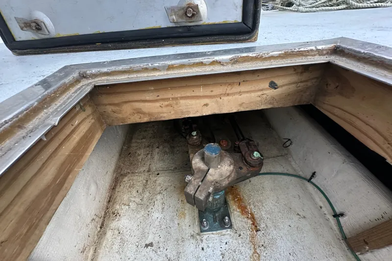 Slide: The Image of Open hatch of a 2003 BHM Sport Fish boat showing mechanical components. - 36