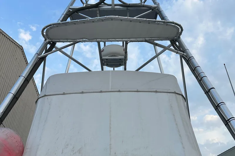 Slide: The Image of 2003 BHM Sport Fish boat tower against a cloudy sky. - 9