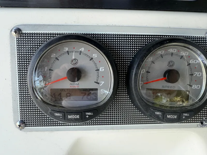 Slide: The Image of Dashboard of a 2022 Boston Whaler 170 Montauk boat showing RPM and speed gauges. - 34