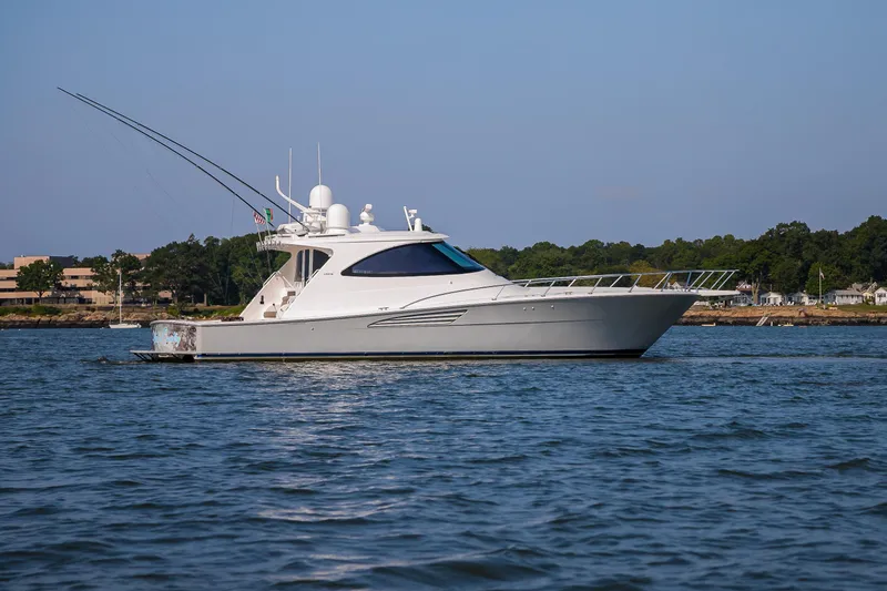 Slide: The Image of 2022 Viking 54 Sport Coupe yacht with spacious deck and elegant design. - 10