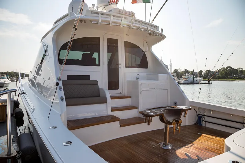 Slide: The Image of Luxurious wood finish on 2022 Viking 54 Sport Coupe yacht deck. - 27