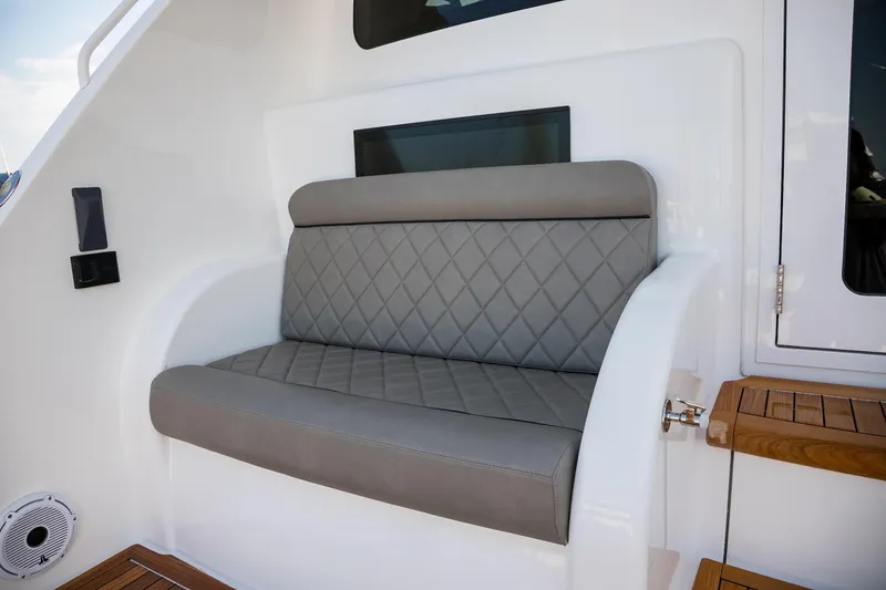 Slide: The Image of Luxury sink and controls on 2022 Viking 54 Sport Coupe yacht deck. - 36