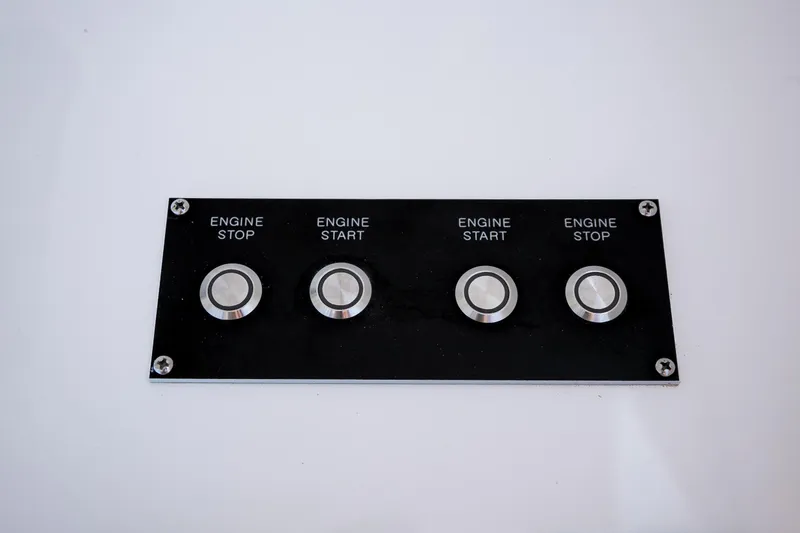 Slide: The Image of Control panel of 2022 Viking 54 Sport Coupe yacht with modern throttle levers. - 40