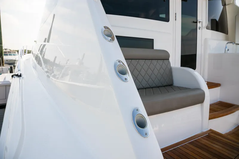 Slide: The Image of Luxurious bedroom interior of 2022 Viking 54 Sport Coupe yacht with elegant decor. - 49