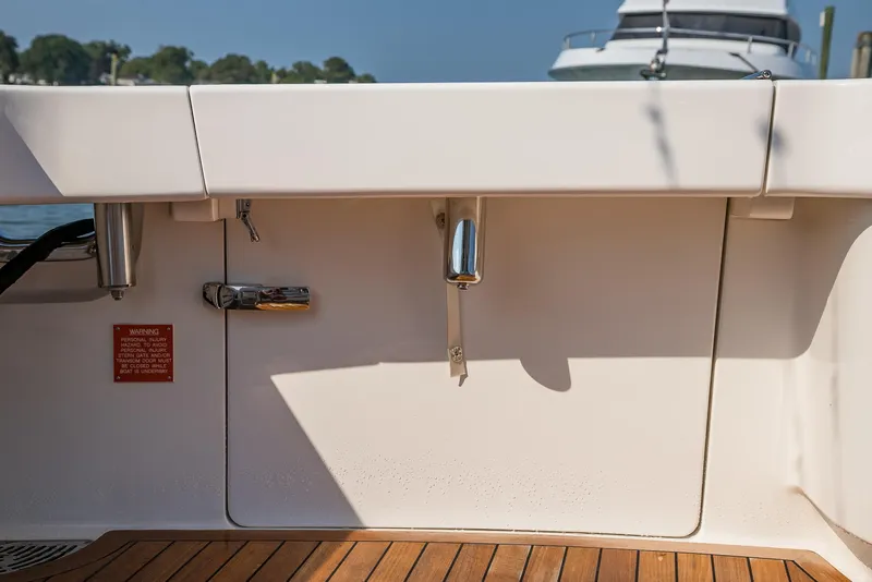 Slide: The Image of Luxurious interior of 2022 Viking 54 Sport Coupe yacht with sleek wood finishes. - 52