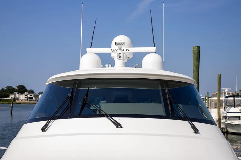 Slide: The Image of Luxurious interior of 2022 Viking 54 Sport Coupe yacht, featuring bedroom and bathroom. - 58