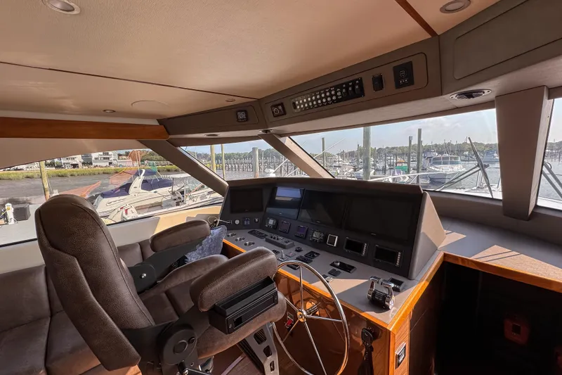 Slide: The Image of Luxurious bathroom in 2022 Viking 54 Sport Coupe yacht with modern fixtures and elegant design. - 59