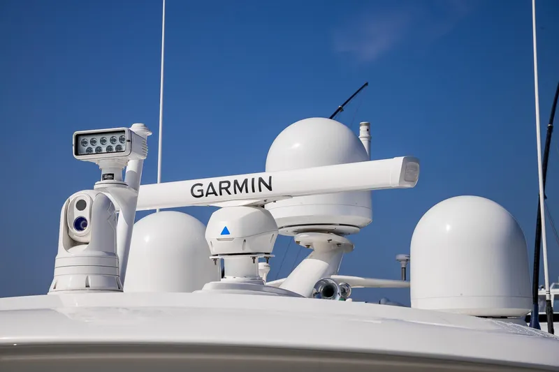 Slide: The Image of Luxurious bathroom in 2022 Viking 54 Sport Coupe with marble countertop and elegant decor. - 61