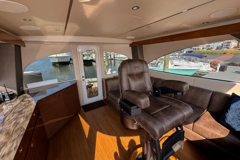 Slide: The Image of Luxurious bathroom in 2022 Viking 54 Sport Coupe yacht with modern shower and elegant vanity. - 62