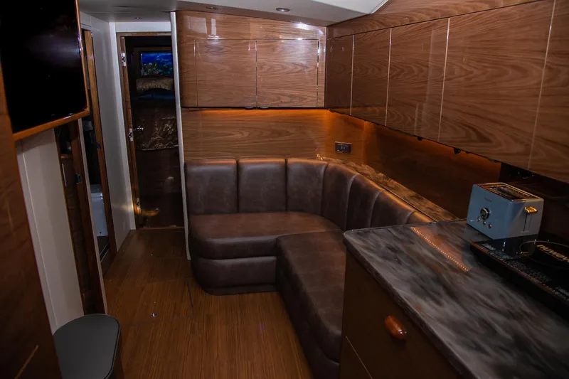 Slide: The Image of Engine room of 2022 Viking 54 Sport Coupe, featuring dual MAN engines and advanced systems. - 70