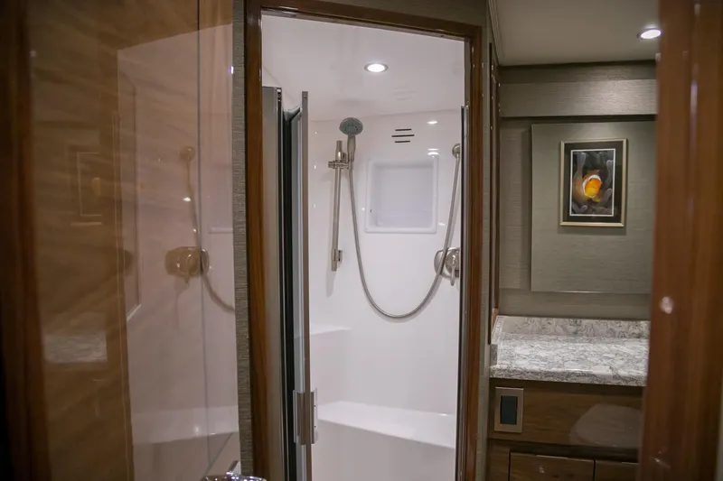 Slide: The Image of Engine room of 2022 Viking 54 Sport Coupe with Dometic system and hydraulic components. - 78