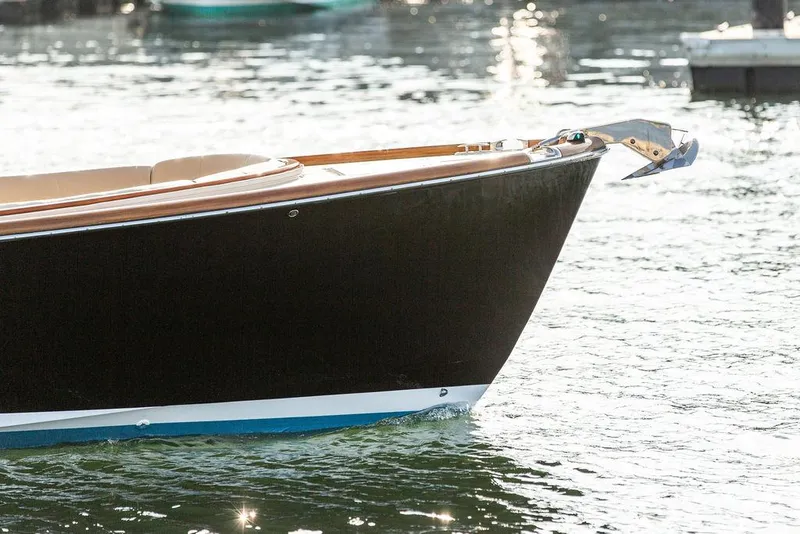Slide: The Image of Hinckley T29 CC 2014 boat bow on water, showcasing sleek design and craftsmanship. - 26