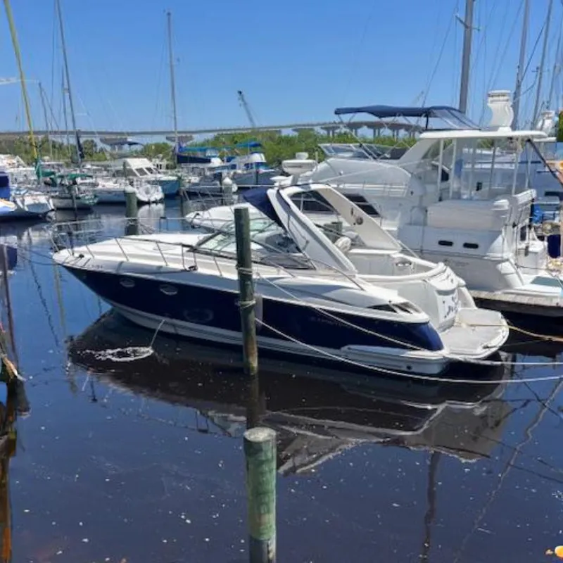 The Image of 2007 Monterey 350 Sport Yacht docked in a marina, surrounded by other boats. - 0