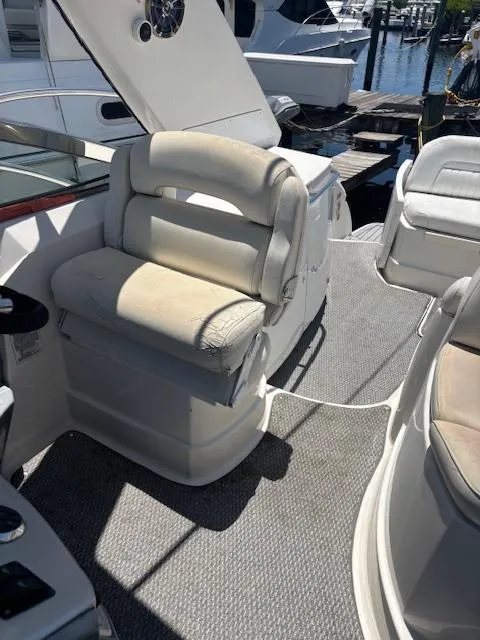 Slide: The Image of 2007 Monterey 350 Sport Yacht interior with cushioned seating and carpeted flooring. - 15