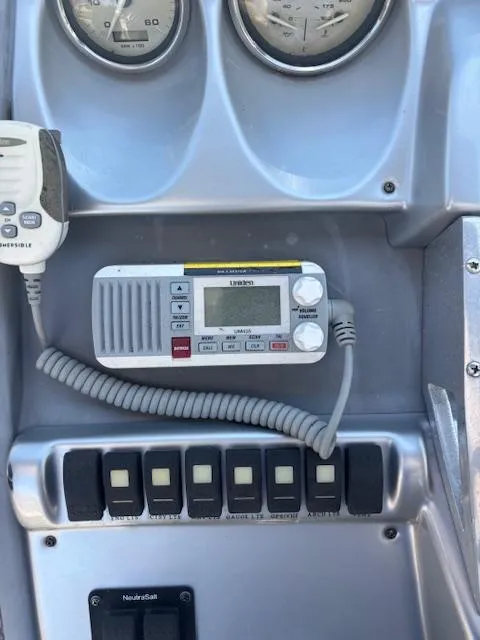 Slide: The Image of Control panel of a 2007 Monterey 350 Sport Yacht with radio and switches. - 18