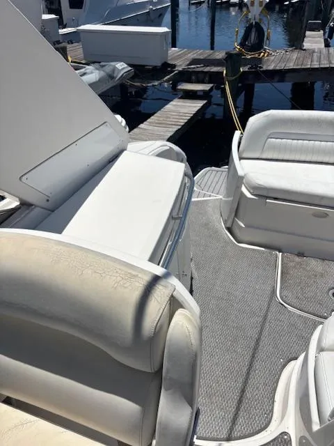Slide: The Image of 2007 Monterey 350 Sport Yacht interior with white seating and dock view. - 20