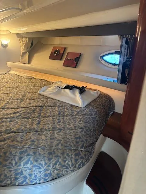 Slide: The Image of Interior cabin of a 2007 Monterey 350 Sport Yacht with cozy bedding and decor. - 31