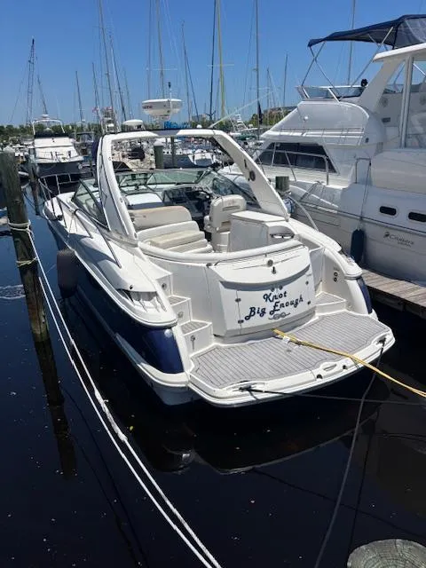 Slide: The Image of 2007 Monterey 350 Sport Yacht docked in marina, surrounded by other boats. - 6