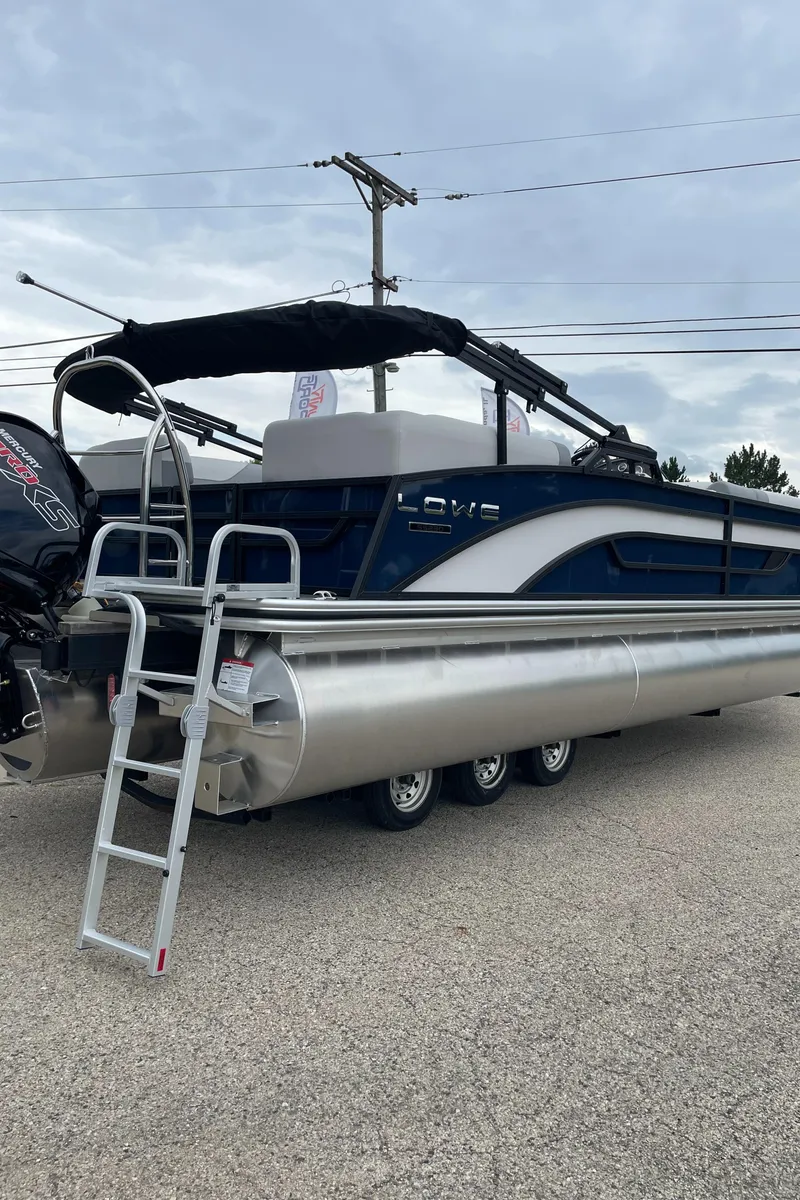 Slide: The Image of 2026 Lowe SS 230 WT Special pontoon boat with ladder and outboard motor. - 4