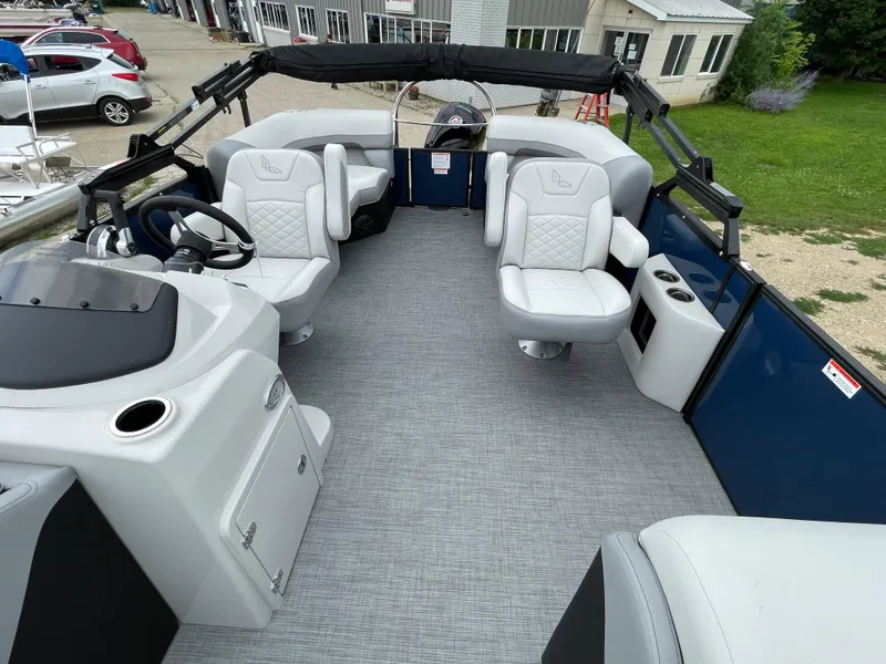 Slide: The Image of 2026 Lowe SS 230 WT Special pontoon boat interior with plush seating and modern helm. - 6