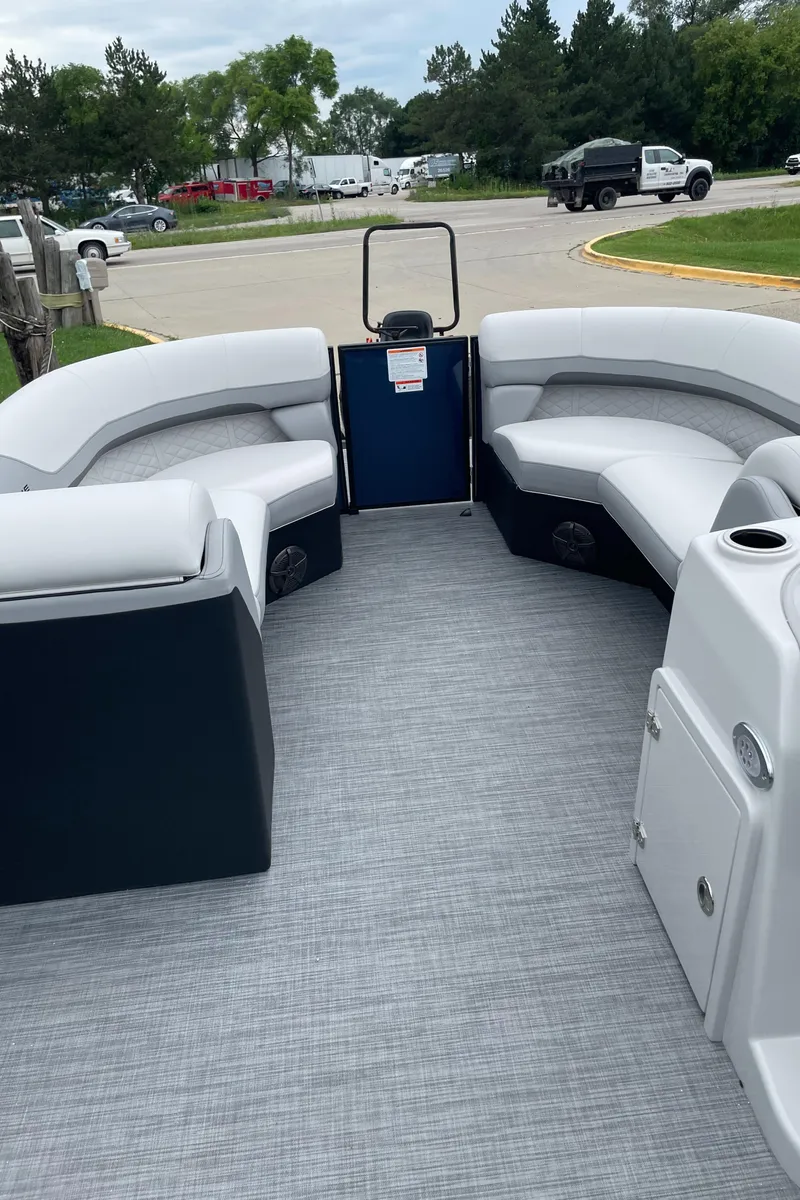 Slide: The Image of 2026 Lowe SS 230 WT Special pontoon boat interior with gray seating and flooring. - 8