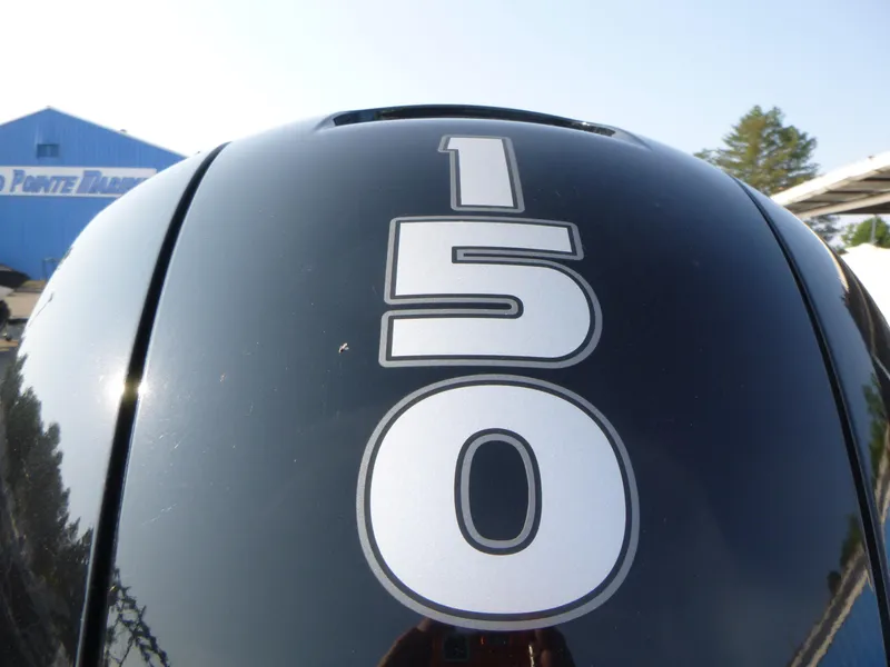 Slide: The Image of Close-up of 150 horsepower engine on 2024 Tracker Grizzly 2072 CC Sportsman boat. - 13