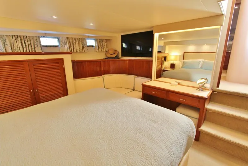 Slide: The Image of Luxurious bedroom interior of 1992 Tollycraft 53 Motor Yacht with elegant furnishings. - 10