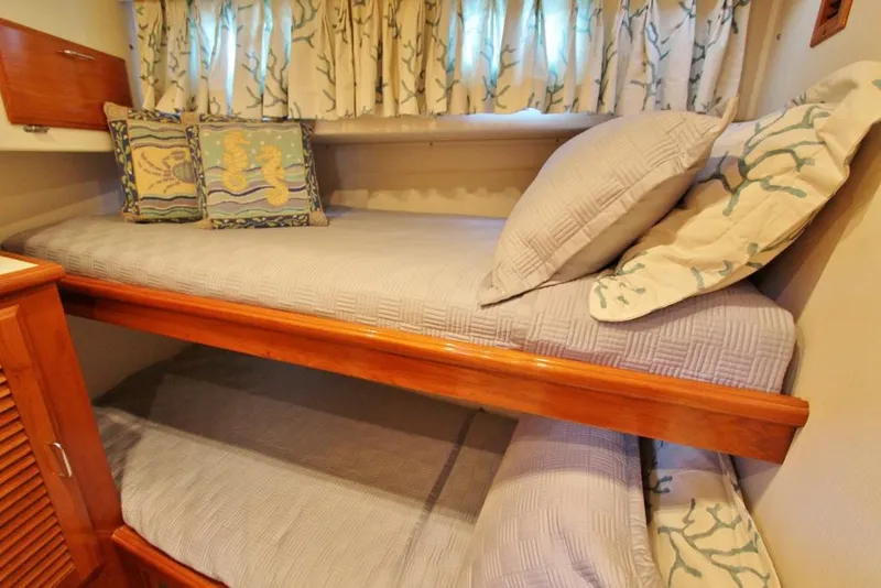 Slide: The Image of Bunk beds in 1992 Tollycraft 53 Motor Yacht cabin with nautical-themed decor. - 13