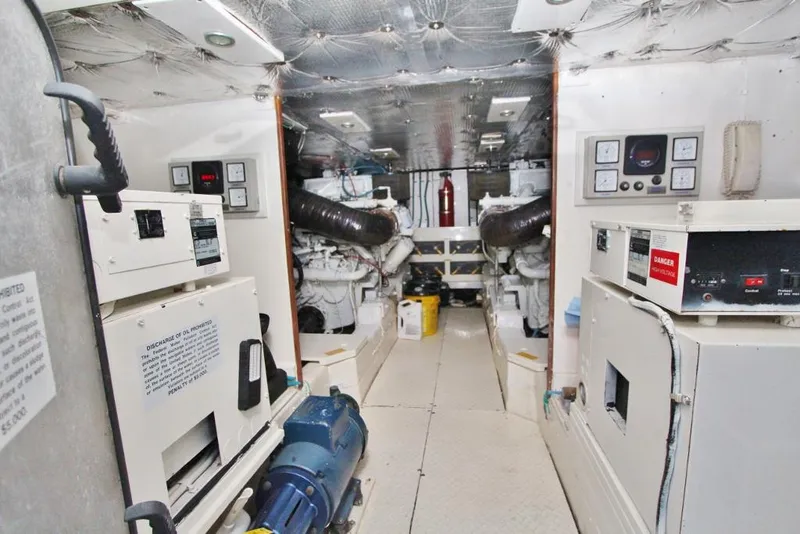 Slide: The Image of Engine room of 1992 Tollycraft 53 Motor Yacht with control panels and machinery. - 21