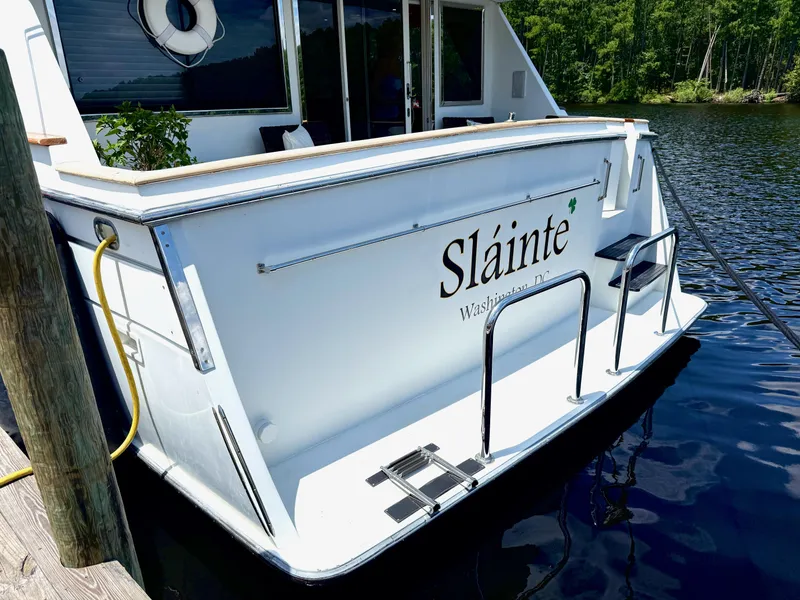 Slide: The Image of 1992 Tollycraft 53 Motor Yacht docked, featuring "Sláinte" name on the stern. - 23