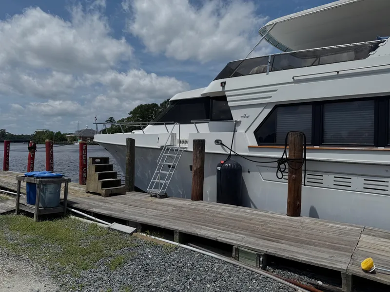 Slide: The Image of Tollycraft 53 Motor Yacht 1992 docked at a marina under a cloudy sky. - 24