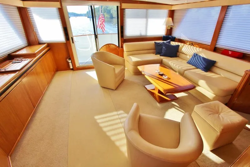Slide: The Image of Luxurious interior of 1992 Tollycraft 53 Motor Yacht with elegant seating and scenic view. - 6