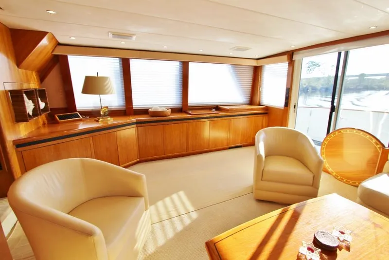 Slide: The Image of Luxurious interior of 1992 Tollycraft 53 Motor Yacht with elegant seating and wood finishes. - 8