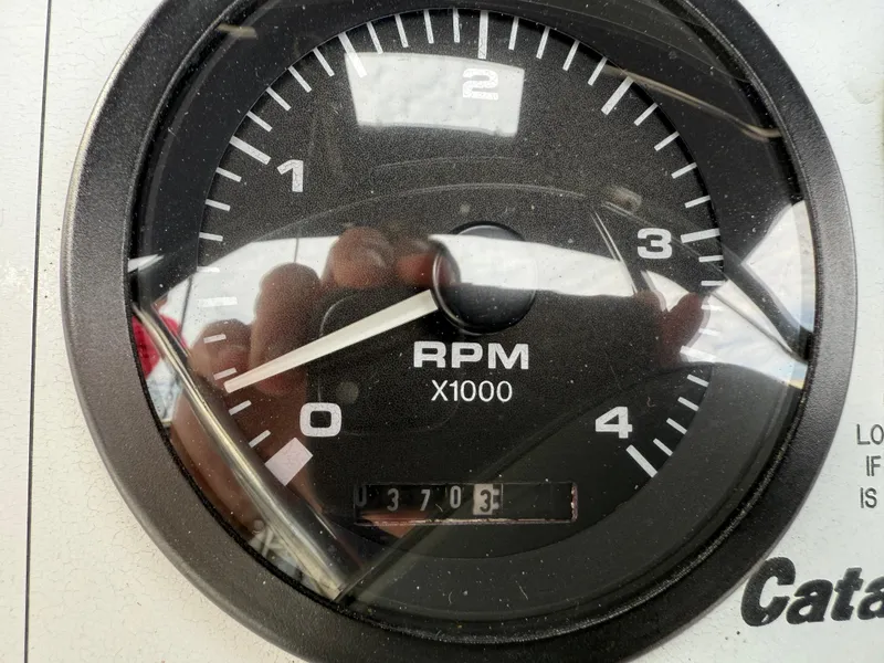 Slide: The Image of Close-up of a Catalina 309 tachometer showing RPM and hours, model year 2007. - 21