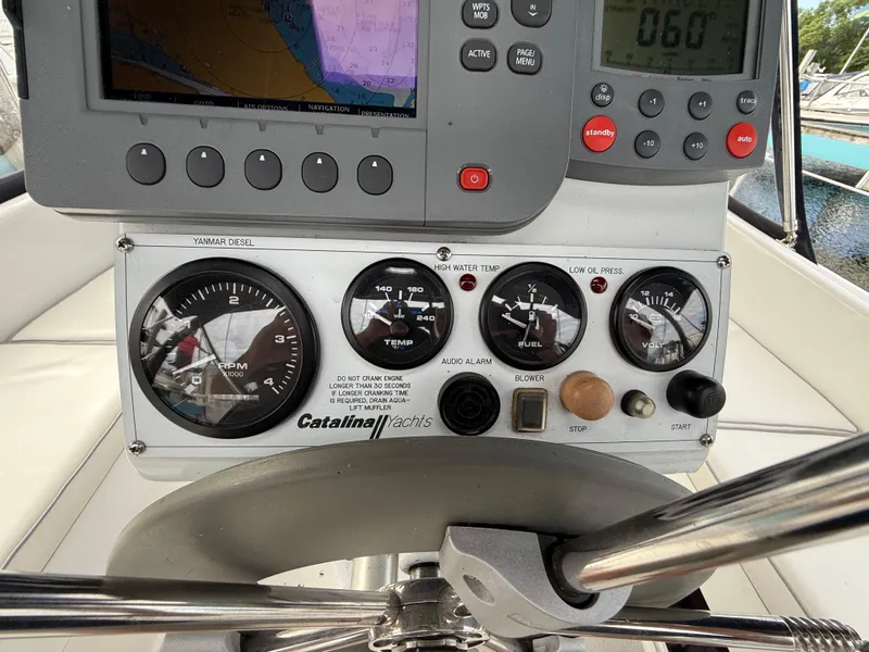 Slide: The Image of Control panel of a 2007 Catalina 309 yacht with navigation and engine gauges. - 22