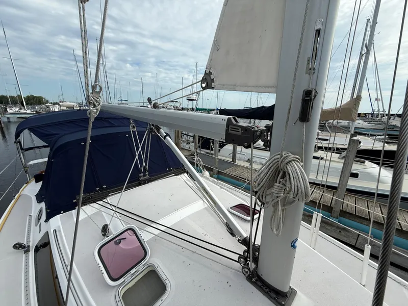 Slide: The Image of Catalina 309 sailboat, 2007 model, docked at marina with rigging and canopy visible. - 23