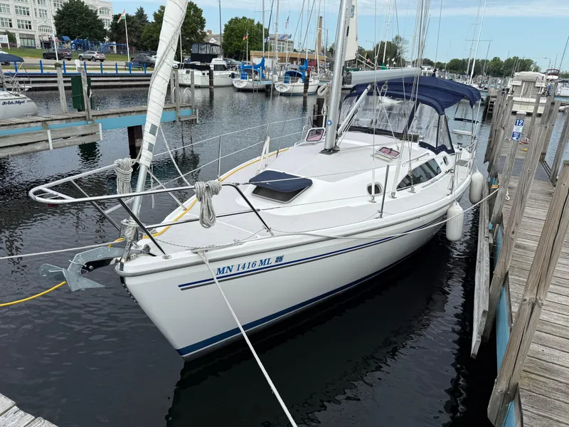 Slide: The Image of Catalina 309 sailboat docked in marina, 2007 model, white hull, blue accents. - 3