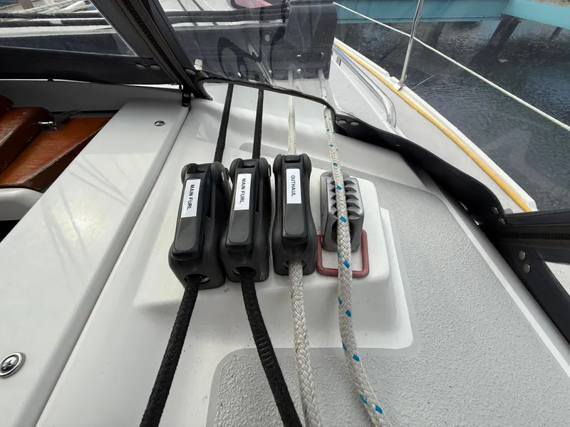 Slide: The Image of Sailboat deck with labeled rope clutches on a 2007 Catalina 309. - 30